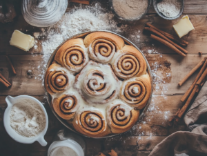 Indulge in the ultimate treat—a perfectly baked cinnamon roll layered with gooey cinnamon filling and topped with creamy frosting that melts into every swirl. The irresistible aroma and soft texture make it an unforgettable delight.